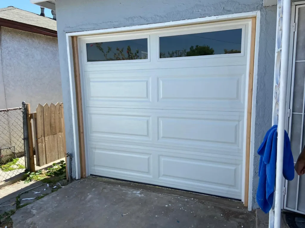White garage door installation by Top One Garage Doors